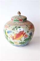 Famille rose covered jar, decorated with fish