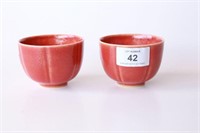 Pair of red glazed lobed wine cups with 6