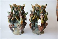 Unusual pair of Chinese Tang sancai candle stands,