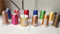 11 new spools of thread and one ribbon