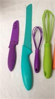 Group of colorful knives some with sheaths and