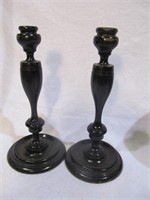 Pair of wooden candleholders, scuff at top