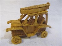 Straw woven car w. boat on top