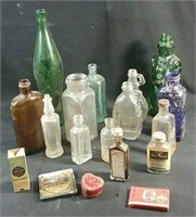 assorted antique bottles & tins