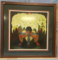 Double matted and framed print of a lady carrying
