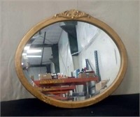 Gold framed oval mirror