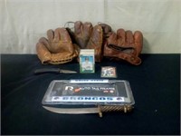 Old baseball gloves, trading cards, knives,