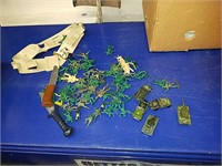 Collection of little green army men with their