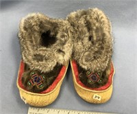 Pair of ugruk hide shoes about 9.5", with seal and