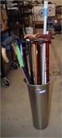 Metal Umbrella Stand w/ Canes, and Two Bats