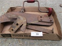 Old wooden brace, old crow bar, old plow head,