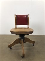 Vintage oak chair on casters