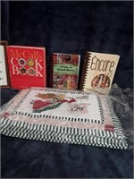 Lot of place mats and cook books
