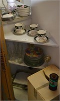 assorted dishes on shelf and box