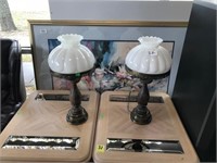 pair of bronze lamps with milk glass shades