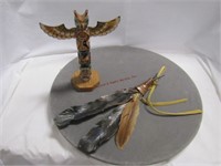 Wood totem pole made in Alaska, metal feathers