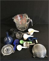 Assorted lot of kitchen measuring ware.