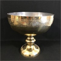 Large metal decorative bowl with engravings.