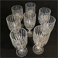 Set of 8 matching cut glass wine glasses.