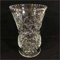 Stunning cut glass flower vase with beveled lip.