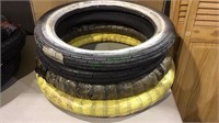 4 rubber tires, 1 white wall marked 2.75-17, 4