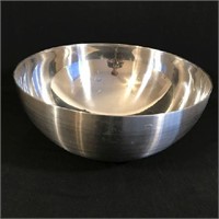Large metal bowl with brushed stainless steel.