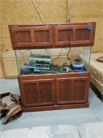 Reptile tank with cabinet and light.