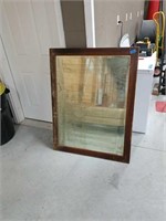 Antique beveled mirror in frame