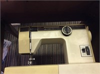 sewing machine in cabinet