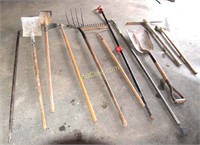 Flat head shovels, pipe wrench, hay fork, pick