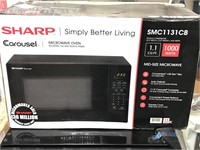 New Sharp Carousel SMC1131CB microwave. Opened