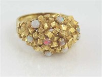 Unusual yellow gold and solid opal ring marked 18K