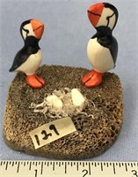 Pair of puffins with shaved baleen nest with 2 ivo