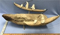 Huge sculpture of 2 kayakers on ancient bone, kaya