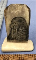 Scrimshawed fossilized walrus ivory with walrus he