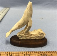 3.25" Carved bone breeching whale, imported