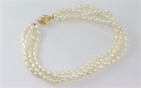 Four strand pearl bracelet with 9ct gold clasp