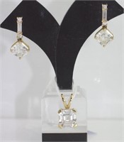 Gold earrings and pendant with diamond simulant