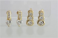 Two pairs of gold earrings with diamond simulants