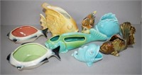 Eight various fish shaped pottery vases