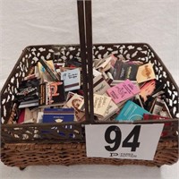 METAL AND WICKER BASKET FILLED WITH MATCHBOOKS