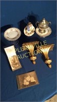 Pair of gold wall sconces, cup/saucers, necklace,