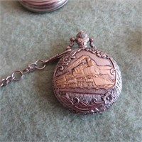 Pocket watch embossed with train