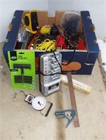 Box of items including rope, battery charger,