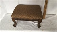 Tan upholstered footstool