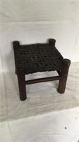 Stick form wooden step stool with woven wooden