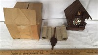 Miniature cuckoo clock with weights, pendulum and