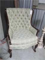 Green tufted chair
