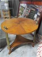 Round coffee table with brass finials