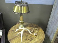 Brass lamp and antlers